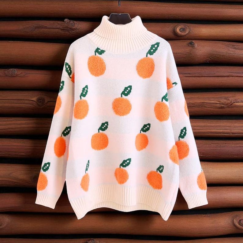 Orangina - Strickpullover mit Fruchtmuster