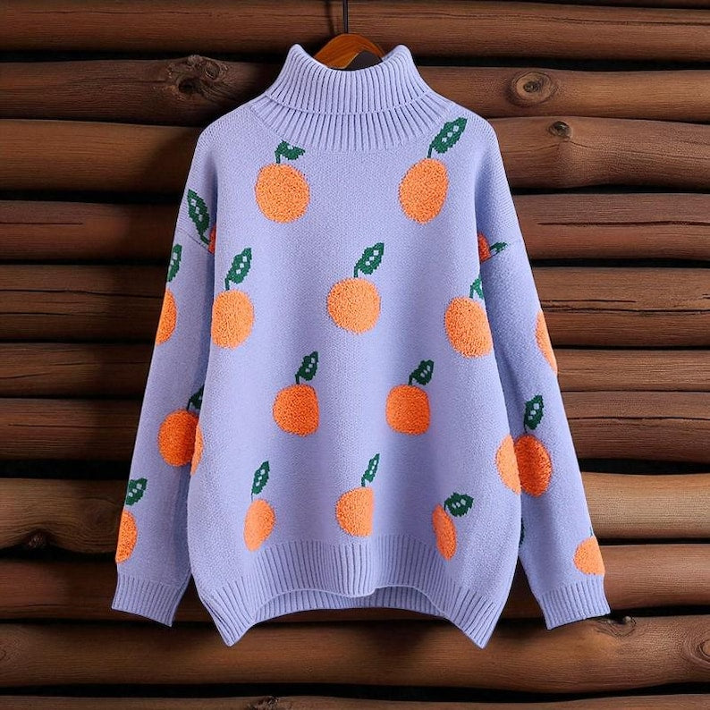Orangina - Strickpullover mit Fruchtmuster